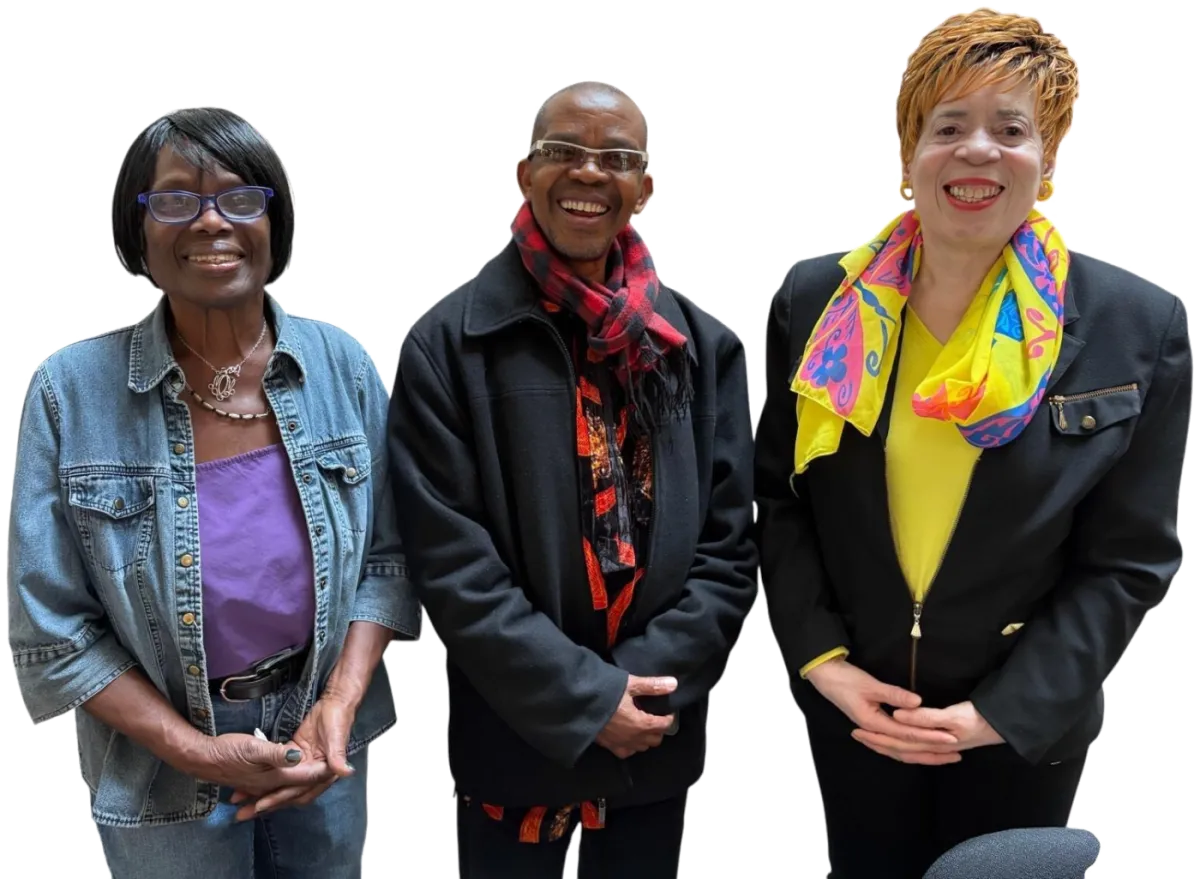 Janice Gordon-Daniels (right) standing with two members of her campaign team, all smiling.